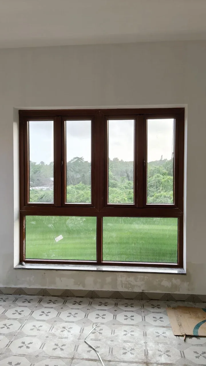 Brown framed double window installation